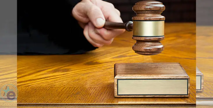 Justice's Hand Pounds Gavel to Block With Blank Plaque