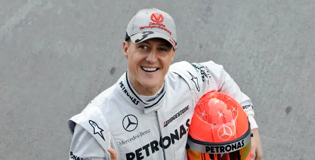 Mercedes Formula One driver Michael Schumacher of Germany poses during a photo call at the Ricardo Tormo race track in Cheste, just outside Valencia, Spain Monday Feb. 1, 2010 (AP Photo/Daniel Ochoa de Olza)