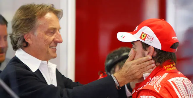 Ferrari President Luca Cordero di Montezemolo, left, pats Ferrari driver Fernando Alonso, of Spain, as the stand at pits following free practice ahead of the Italian Formula One Grand Prix at the Monza racetrack in Monza, Italy, Saturday, Sept 11, 2010.
