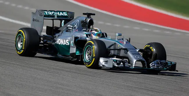Mercedes driver Lewis Hamilton, of Britain, races his car during qualifying for the Formula One U.S. Grand Prix auto race at the Circuit of the Americas, Saturday, Nov. 1, 2014, in Austin, Texas. (AP Photo/Eric Gay)