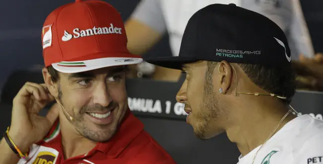 Ferrari driver Fernando Alonso and Mercedes driver Lewis Hamilton of Britain during a news conference at the Monza racetrack, in Monza, Italy, Thursday, Sept. 4 , 2014.