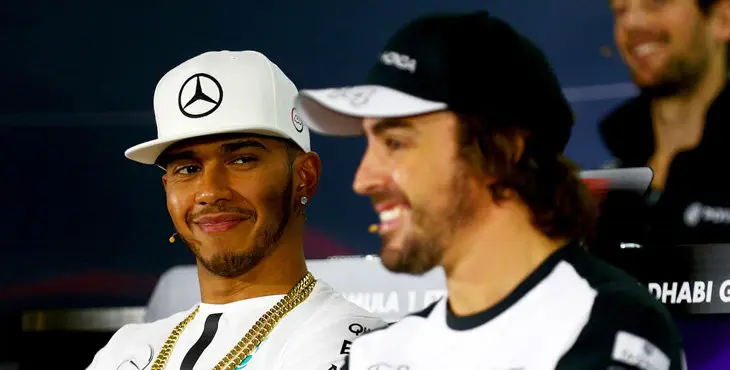 ABU DHABI, UNITED ARAB EMIRATES - NOVEMBER 26: Lewis Hamilton of Great Britain and Mercedes GP smiles as Fernando Alonso of Spain and McLaren Honda speaks at a press confernce during previews for the Abu Dhabi Formula One Grand Prix at Yas Marina Circuit on November 26, 2015 in Abu Dhabi, United Arab Emirates. (Photo by Clive Mason/Getty Images)