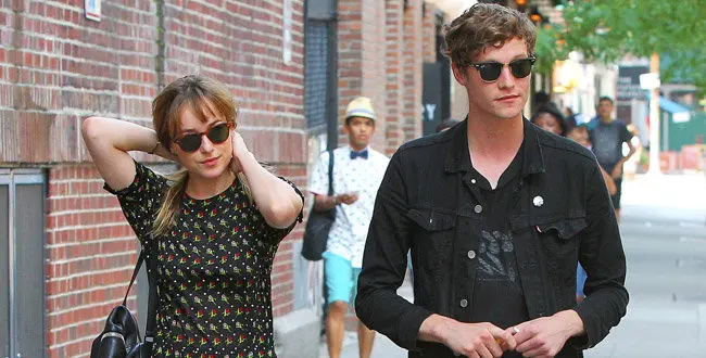 Actress Dakota Johnson and male friend on July 23, 2014 in New York City, New York.