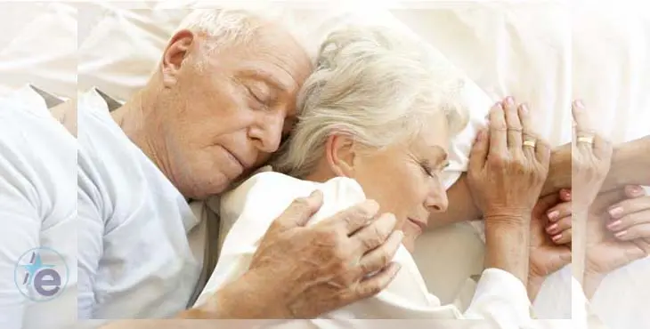 Senior Couple Sleeping In Bed