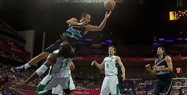 Argentina's Manu Ginobili (up) shoots over Brazil's Nene Hilario during their men's quarterfinal basketball match at the North Greenwich Arena in London during the London 2012 Olympic Games August 8, 2012. REUTERS/Mike Segar (BRITAIN - Tags: SPORT OLYMPICS SPORT BASKETBALL TPX IMAGES OF THE DAY)