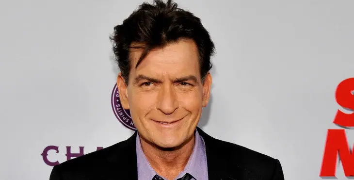 FILE - In this April 11, 2013 file photo, Charlie Sheen, a cast member in "Scary Movie V," poses at the Los Angeles premiere of the film at the Cinerama Dome in Los Angeles. Sheen was sued in Los Angeles Friday, Oct. 3, 2014, by a dental technician who claims the actor punched her in the chest and was abusive during an office visit in late September. (Photo by Chris Pizzello/Invision/AP, file)