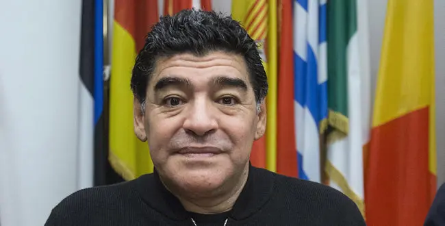 Diego Armando Maradona arrives at a press conference he held to discussed his tax feud with the Italian authority, Rome, Friday, Feb. 14, 2014.