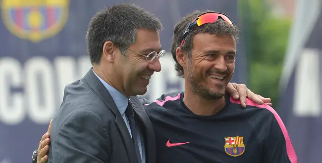 FC Barcelona's president Josep Maria Bartomeu, left, embraces head coach Luis Enrigue prior to a training session at the Sports Center FC Barcelona Joan Gamper in San Joan Despi, Spain, Friday, July 25, 2014.