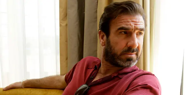soccer player Eric Cantona poses for photographs following an interview for the film 'Looking for Eric', during the 62nd International film festival in Cannes, southern France, Wednesday, May 20, 2009.