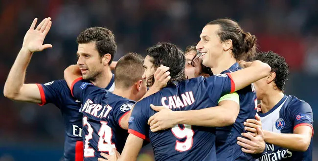 PSG's Zlatan Ibrahimovic, second right, jubilates with Cavani after he scored the opening goal during their Champions League group C soccer match between Paris Saint Germain and Benfica at Parc des Princes stadium, in Paris, Wednesday, Oct.2, 2013.