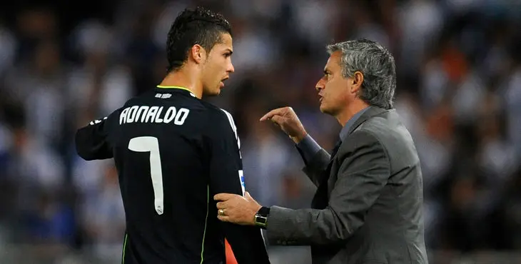 Real Madrid's coach Jose Mourinho gives instructions to Cristiano Ronaldo during their Spanish First Division soccer match against Real Sociedad at the Anoeta stadium in San Sebastian September 18, 2010. REUTERS/Felix Ordonez (SPAIN - Tags: SPORT SOCCER)