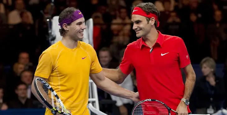 Spain's Rafael Nadal (L) poses with Switzerland's Roger Federer prior to their charity game on December 21, 2010 in Zurich. "The Match for Africa" was organized to raises money for the Roger Federer Foundation which supports sporting activities for underprivileged children in Africa and in Switzerland. AFP PHOTO / FABRICE COFFRINI