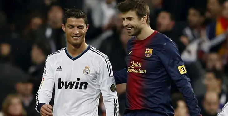 GRA553. MADRID, 30/01/2013.- El delantero portugués del Real Madrid, Cristiano Ronaldo (i), y el defensa del F. C. Barcelona, Gerard Piqué, durante el encuentro correspondiente a la ida de las semifinales de la Copa del Rey, que han disputado esta noche en el estadio Santiago Bernabéu, en Madrid. EFE / JuanJo Martín.