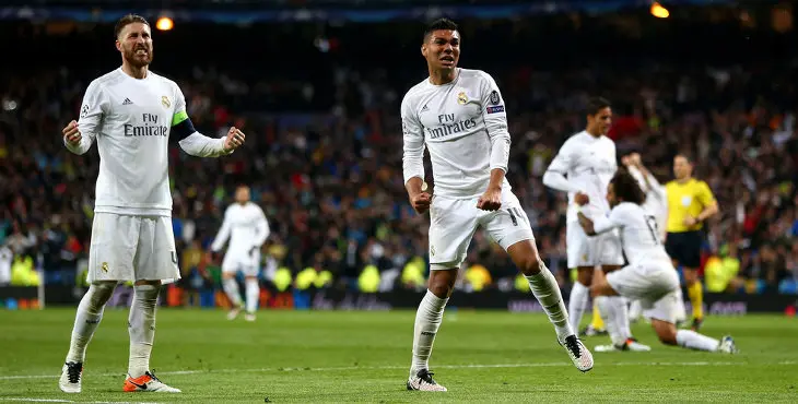 MADRID, SPAIN - APRIL 12:  Sergio Ramos (L) and Casemiro of Real Madrid celebrate victory and reaching the semi finals after the UEFA Champions League quarter final second leg match between Real Madrid CF and VfL Wolfsburg at Estadio Santiago Bernabeu on April 12, 2016 in Madrid, Spain.  (Photo by Alex Grimm/Bongarts/Getty Images)
