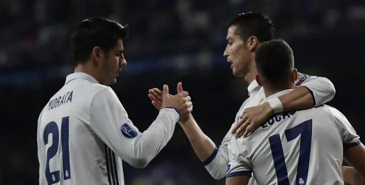 Real Madrid's midfielder Lucas Vazquez (R), Real Madrid's forward Alvaro Morata (L) and Real Madrid's Portuguese forward Cristiano Ronaldo celebrate after scoring a goal during the UEFA Champions League football match Real Madrid CF vs Legia Legia Warszawa at the Santiago Bernabeu stadium in Madrid on October 18, 2016. / AFP / JAVIER SORIANO (Photo credit should read JAVIER SORIANO/AFP/Getty Images)