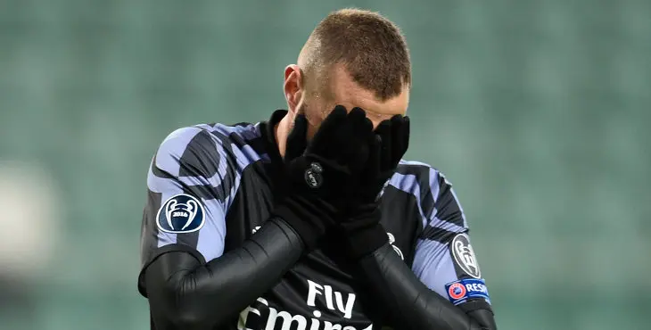 Real Madrid's French forward Karim Benzema reacts after Warsaw scored the 2-2 equalizer during the UEFA Champions League group F football match Legia Warsaw vs Real Madrid CF in Warsaw, Poland on November 2, 2016. / AFP / ODD ANDERSEN (Photo credit should read ODD ANDERSEN/AFP/Getty Images)