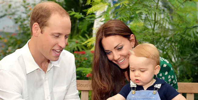 This photo taken Wednesday, July 2, 2014, and released Monday, July 21, 2014, to mark Prince George's first birthday, shows Britain's Prince William and Kate Duchess of Cambridge and the Prince during a visit to the Sensational Butterflies exhibition at the Natural History Museum, London.