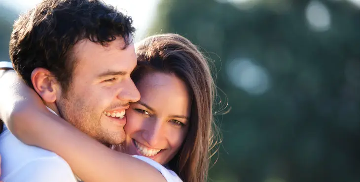 Closeup on young beautiful smiling couple.