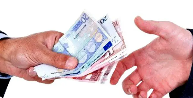 Euro bills changing hands isolated in white