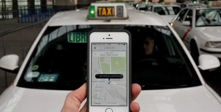 MADRID, SPAIN - OCTOBER 14: In this photo illustration the new smart phone taxi app 'Uber' shows how to select a pick up location at Atocha Station on October 14, 2014 in Madrid, Spain. 'Uber' application started to operate in Madrid last September despite Taxi drivers claim it is an illegal activity and its drivers currently operate without a license. 'Uber' is an American based company which is quickly expanding to some of the main cities from around the world. (Photo by Pablo Blazquez Dominguez/Getty Images)