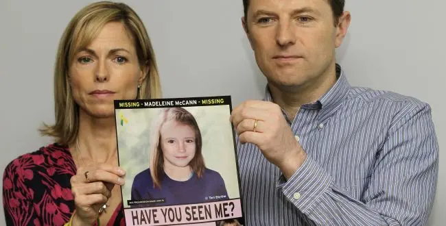 Kate and Gerry McCann pose with a missing poster of their daughter Madeleine as talk to the media in London Wednesday, May 2, 2012 to mark their daughter Madeleine's birthday and the 5th anniversary of their daughter disappearance