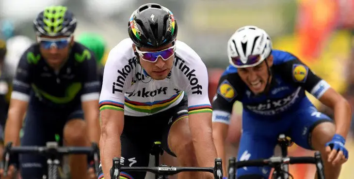 Slovakia's Peter Sagan (C) crosses the finish line ahead of France's Julian Alaphilippe (R) and Spain's Alejandro Valverde (L) at the end of the 183 km second stage of the 103rd edition of the Tour de France cycling race on July 3, 2016 between Saint-Lo and Cherbourg-en-Cotentin, Normandy. / AFP PHOTO / LIONEL BONAVENTURE
