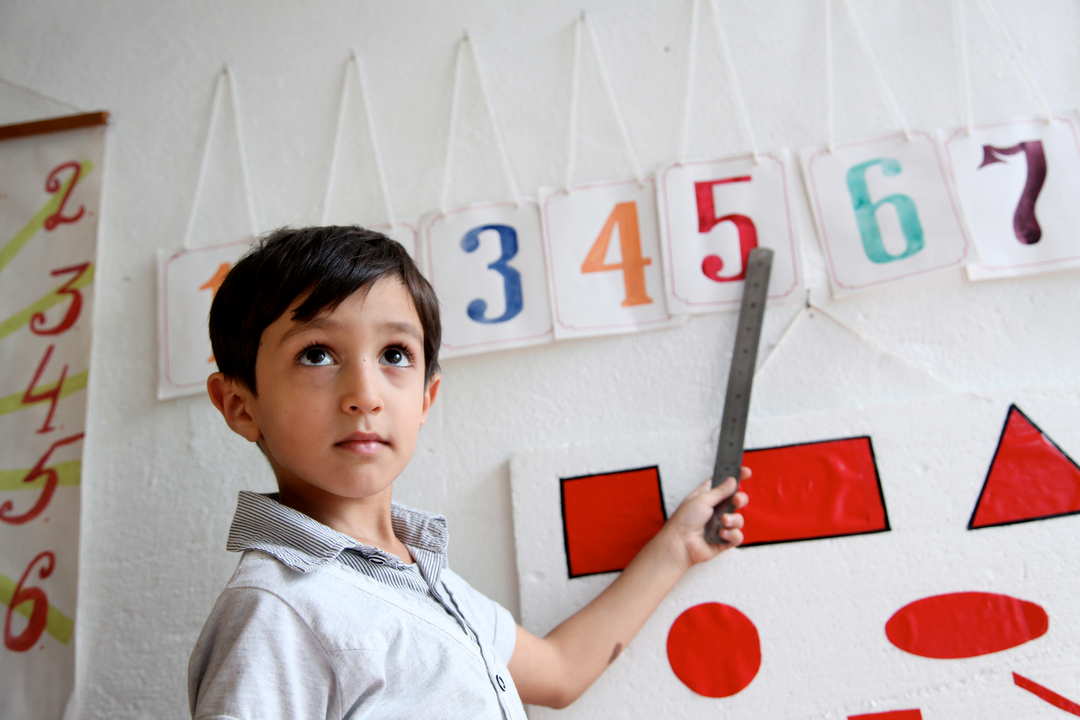 2011, Southern city of Lenkaran. UNICEF supported pre-school #9. A boy learns how to read numbers on her first day in school after the summer holidays.