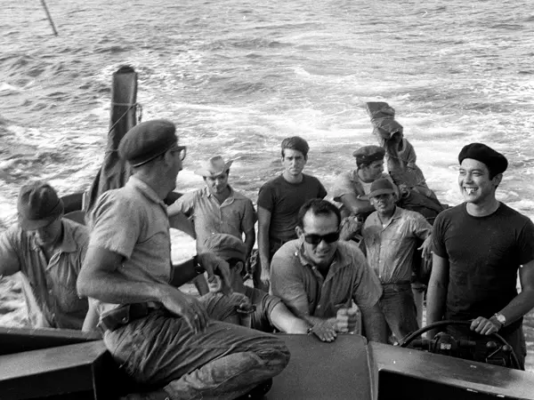 In this undated photo 22-years-old anti-Castro activist Santiago Alvarez, center with sun glasses, and his crew prepare for action, somewhere in Nicaragua, against Fidel Castro's government three years after the defeat of Cuban exiles in Bay of Pigs. The failed Bay of Pigs invasion 50 years ago this weekend forever shaped the lives of the Cuban exiles sent by the U.S. to fight. (AP Photo/Jim Nickless)