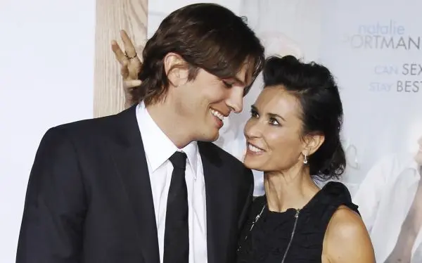 Cast member Ashton Kutcher and his wife actress Demi Moore attend the premiere of "No Strings Attached" at the Regency Village theatre in Los Angeles in this January 11, 2011 file photo. Two and a Half Men" star Kutcher filed for divorce from actress wife Moore on December 21, 2012 in Los Angeles, following more than a year of separation, according to court documents. REUTERS/Mario Anzuoni/Files (UNITED STATES - Tags: ENTERTAINMENT)