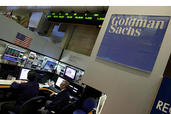 Traders work in the Goldman Sachs booth on the floor of the New York Stock Exchange Monday, April 19, 2010. (AP Photo/Richard Drew)