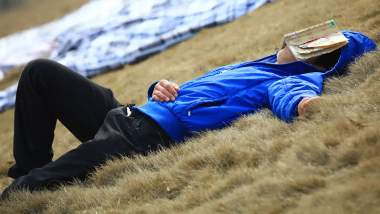 JIUJIANG, CHINA - MARCH 12:  (CHINA OUT) A student sleeps with a book covering his face as sheets laid on the ground are aired in the sun at Jiujiang University on March 12, 2012 in Jiujiang, Jiangxi Province of China. After a long winter vacation returning Chinese students will air their sheets, duvets and clothes in the grounds of the halls of residence to help freshen them up.  (Photo by ChinaFotoPress/ChinaFotoPress via Getty Images)