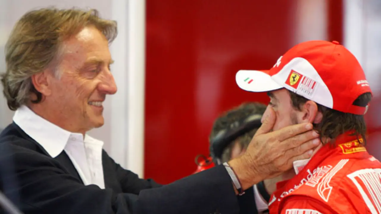 Ferrari President Luca Cordero di Montezemolo, left, pats Ferrari driver Fernando Alonso, of Spain, as the stand at pits following  free practice ahead of the Italian Formula One Grand Prix at the Monza racetrack in Monza, Italy, Saturday, Sept 11, 2010.