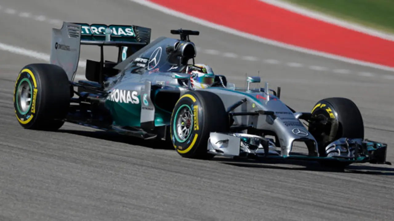 Mercedes driver Lewis Hamilton, of Britain, races his car during qualifying for the Formula One U.S. Grand Prix auto race at the Circuit of the Americas, Saturday, Nov. 1, 2014, in Austin, Texas. (AP Photo/Eric Gay)