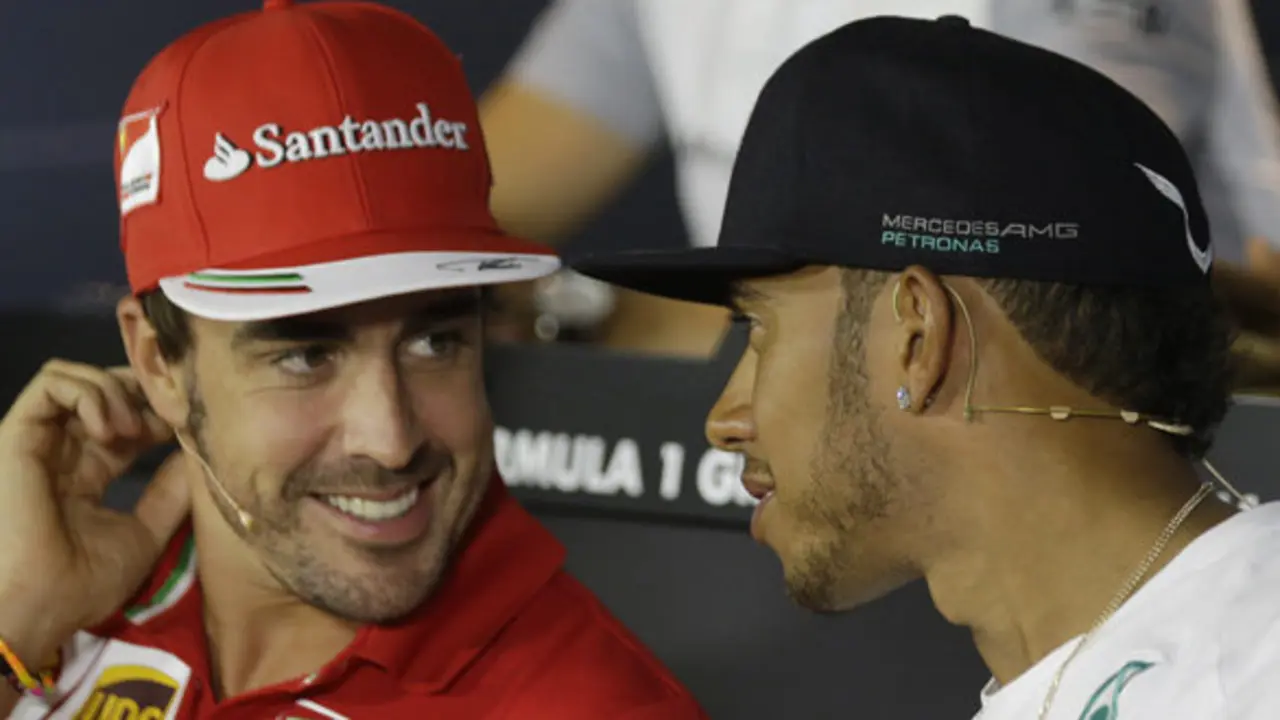 Ferrari driver Fernando Alonso and Mercedes driver Lewis Hamilton of Britain during a news conference at the Monza racetrack, in Monza, Italy, Thursday, Sept. 4 , 2014.
