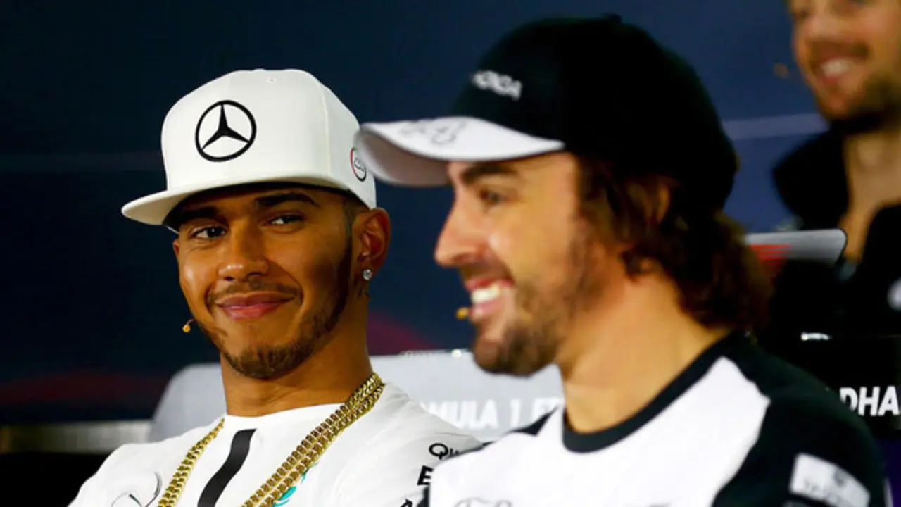 ABU DHABI, UNITED ARAB EMIRATES - NOVEMBER 26:  Lewis Hamilton of Great Britain and Mercedes GP smiles as Fernando Alonso of Spain and McLaren Honda speaks at a press confernce during previews for the Abu Dhabi Formula One Grand Prix at Yas Marina Circuit on November 26, 2015 in Abu Dhabi, United Arab Emirates.  (Photo by Clive Mason/Getty Images)