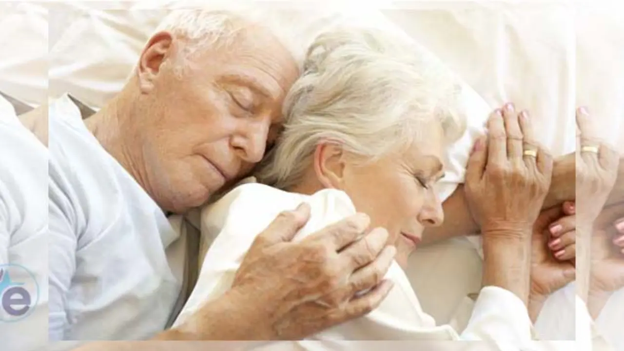 Senior Couple Sleeping In Bed