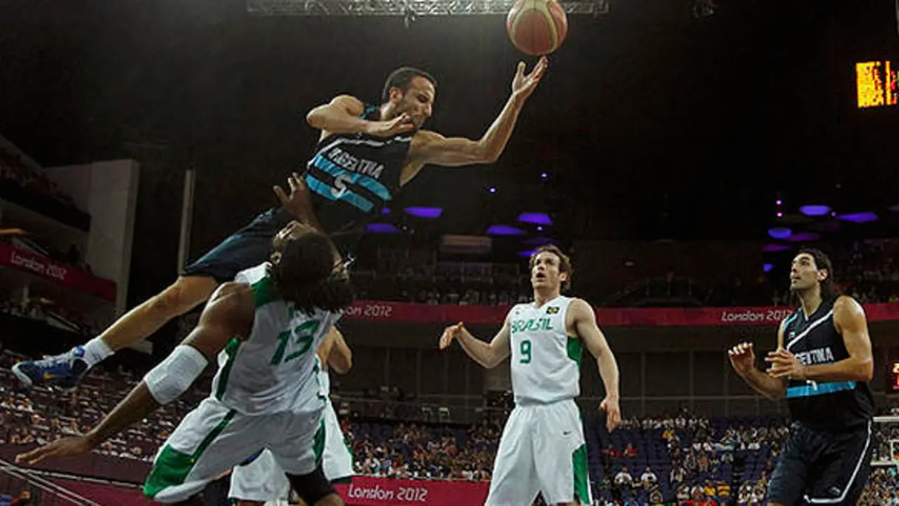 Argentina's Manu Ginobili (up) shoots over Brazil's Nene Hilario during their men's quarterfinal basketball match at the North Greenwich Arena in London during the London 2012 Olympic Games August 8, 2012.                        REUTERS/Mike Segar (BRITAIN  - Tags: SPORT OLYMPICS SPORT BASKETBALL TPX IMAGES OF THE DAY)