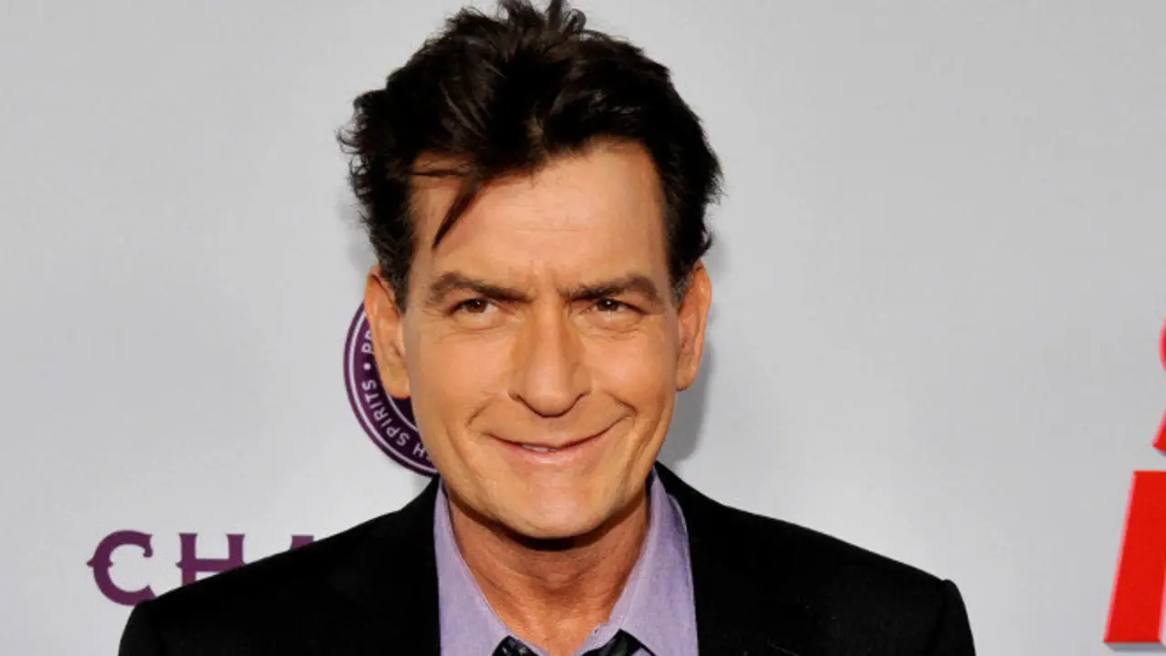 FILE - In this April 11, 2013 file photo, Charlie Sheen, a cast member in "Scary Movie V," poses at the Los Angeles premiere of the film at the Cinerama Dome in Los Angeles. Sheen was sued in Los Angeles Friday, Oct. 3, 2014, by a dental technician who claims the actor punched her in the chest and was abusive during an office visit in late September. (Photo by Chris Pizzello/Invision/AP, file)