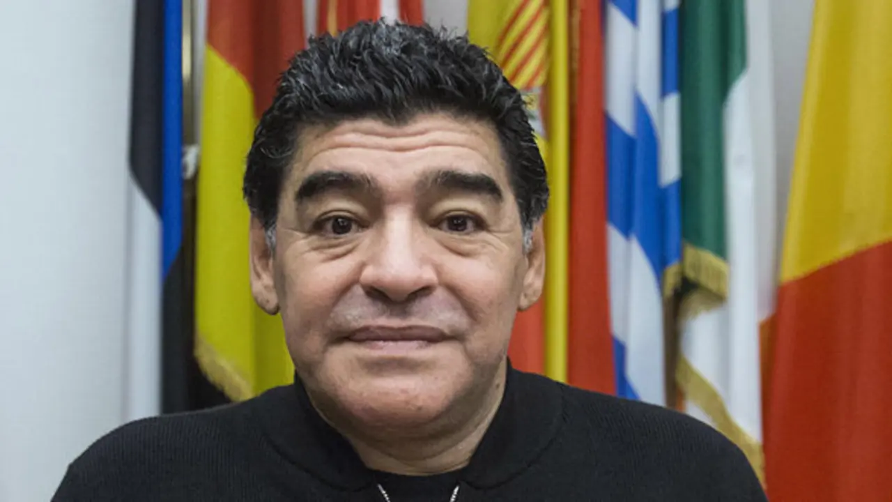 Diego Armando Maradona arrives at a press conference he held to discussed his tax feud with the Italian authority, Rome, Friday, Feb. 14, 2014.