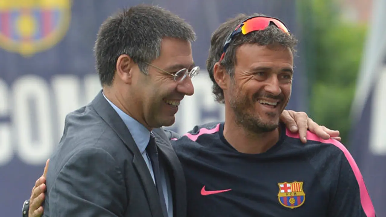 FC Barcelona's president Josep Maria Bartomeu, left, embraces head coach Luis Enrigue prior to a training session at the Sports Center FC Barcelona Joan Gamper in San Joan Despi, Spain, Friday, July 25, 2014.