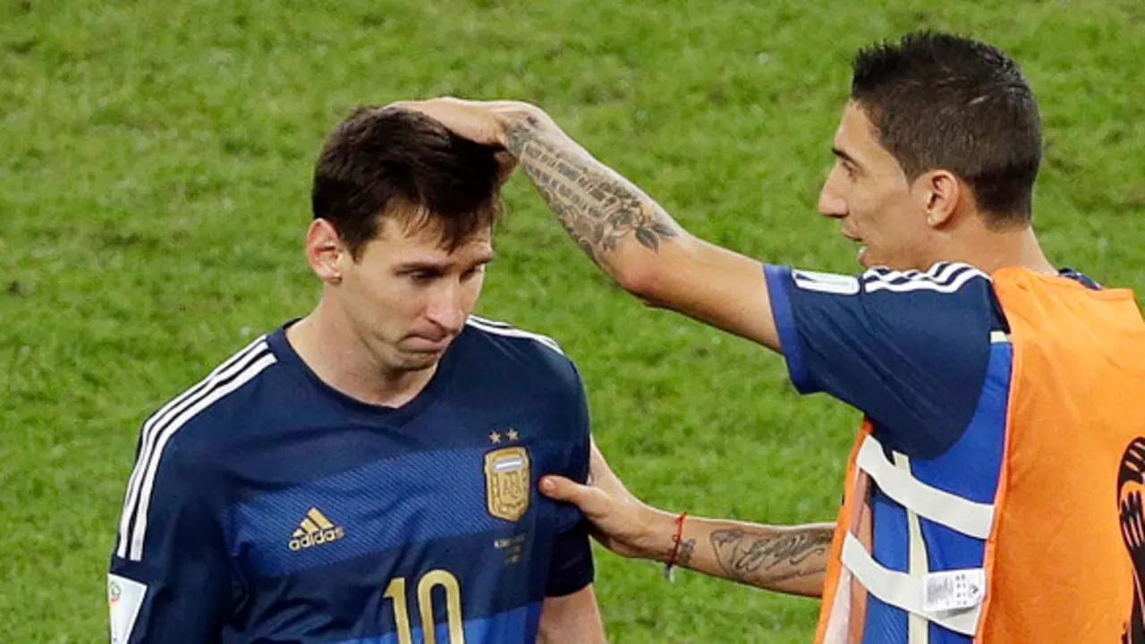 Argentina's Angel di Maria comforts Argentina's Lionel Messi during the extra time of the World Cup final soccer match between Germany and Argentina at the Maracana Stadium in Rio de Janeiro, Brazil, Sunday, July 13, 2014. (AP Photo/Themba Hadebe)