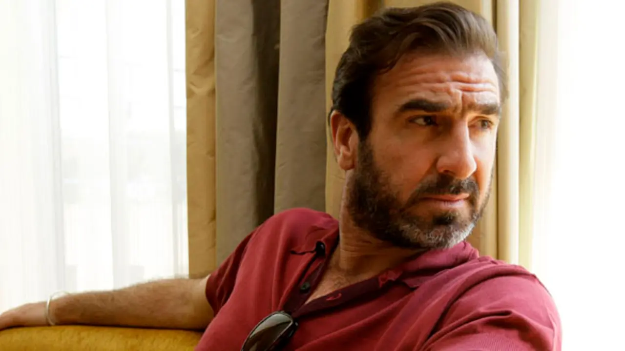 soccer player Eric Cantona poses for photographs following an interview for the film 'Looking for Eric', during the 62nd International film festival in Cannes, southern France, Wednesday, May 20, 2009.