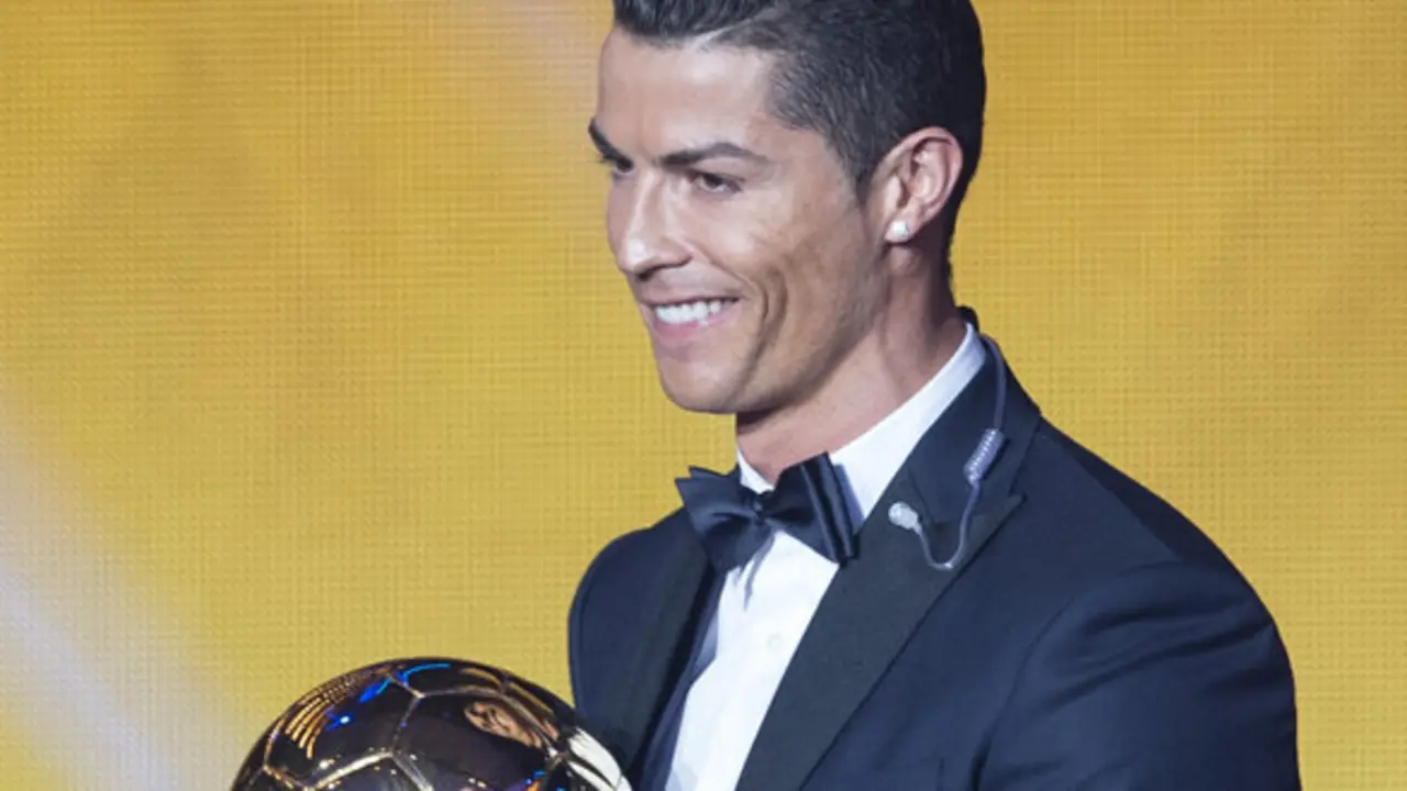 Cristiano Ronaldo of Portugal poses with the trophy after winning the FIFA Men's soccer player of the year 2014 prize at the FIFA Ballon d'Or awarding ceremony at the Kongresshaus in Zurich, Switzerland, Monday,  Jan. 12, 2015.