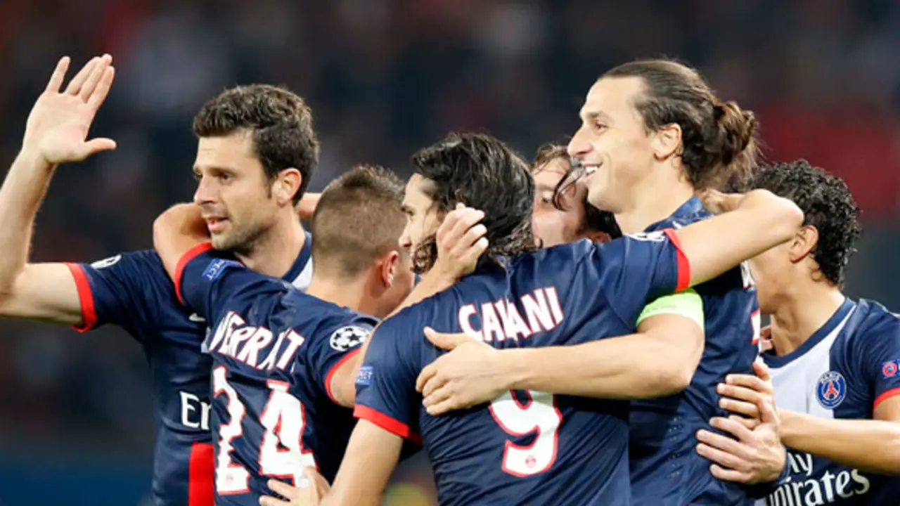 PSG's Zlatan Ibrahimovic, second right, jubilates with Cavani after he scored the opening goal during their Champions League group C soccer match between Paris Saint Germain and Benfica at Parc des Princes stadium, in Paris, Wednesday, Oct.2, 2013.