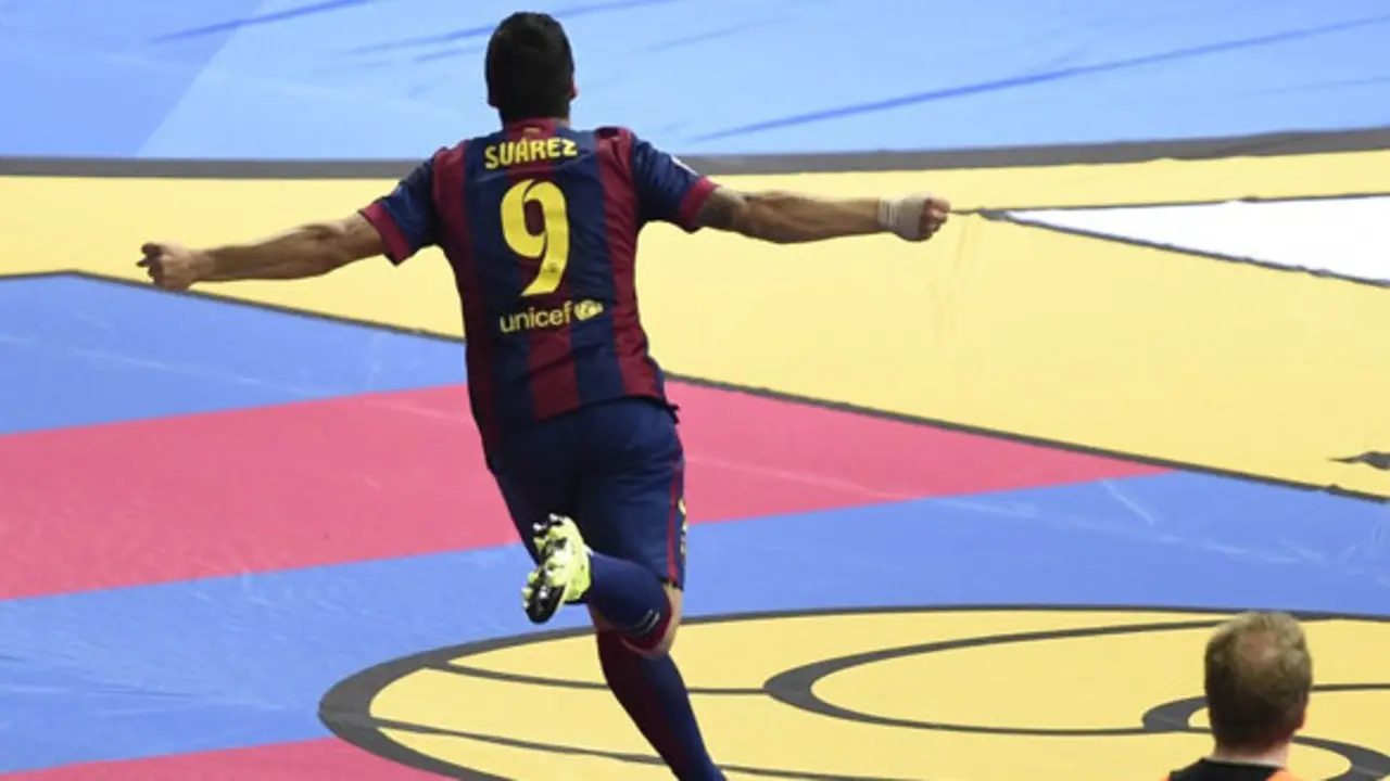Barcelona's Uruguayan forward Luis Suarez celebrates after scoring the 1-2 during the UEFA Champions League Final football match between Juventus and FC Barcelona at the Olympic Stadium in Berlin on June 6, 2015.     AFP PHOTO / ODD ANDERSEN        (Photo credit should read ODD ANDERSEN/AFP/Getty Images)