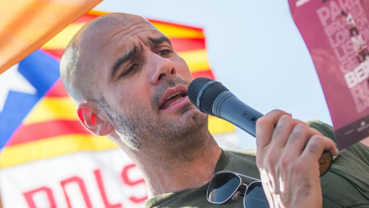 Bayern Munich's coach Pep Guardiola ,  speaks   at  Alexanderplatz  square in Berlin, Germany, Sunday June 8,  2014.