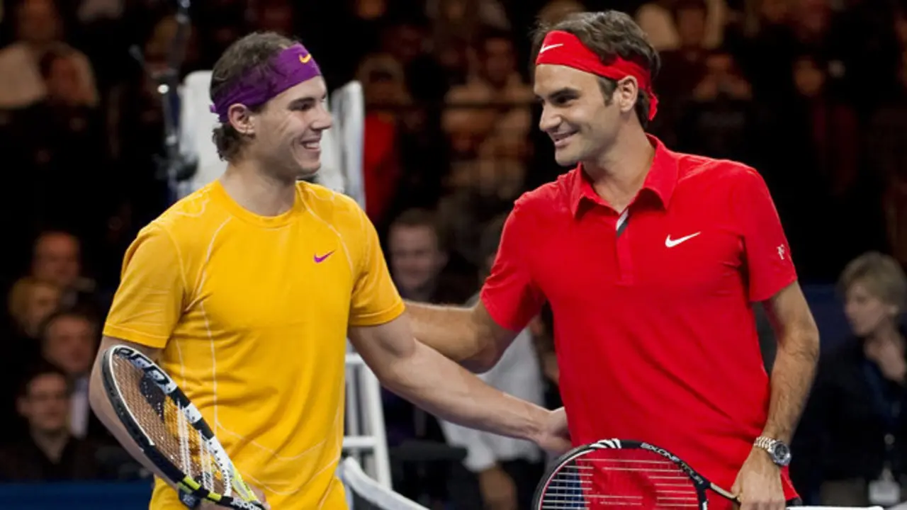 Spain's Rafael Nadal (L) poses with Switzerland's Roger Federer prior to their charity game on December 21, 2010 in Zurich. "The Match for Africa" was organized to raises money for the Roger Federer Foundation which supports sporting activities for underprivileged children in Africa and in Switzerland.   AFP PHOTO / FABRICE COFFRINI