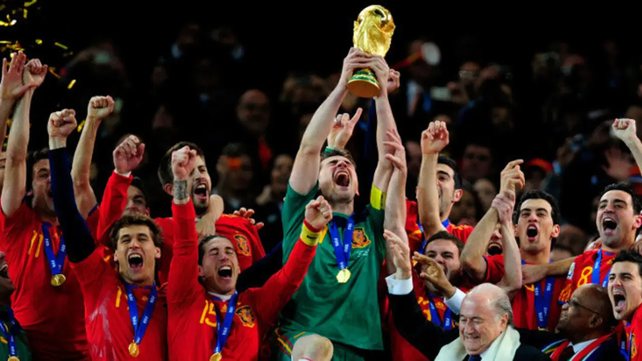 JOHANNESBURG, SOUTH AFRICA - JULY 11:  Iker Casillas of Spain celebrates lifting the World Cup with team mates during the 2010 FIFA World Cup South Africa Final match between Netherlands and Spain at Soccer City Stadium on July 11, 2010 in Johannesburg, South Africa.  (Photo by Jamie McDonald/Getty Images)