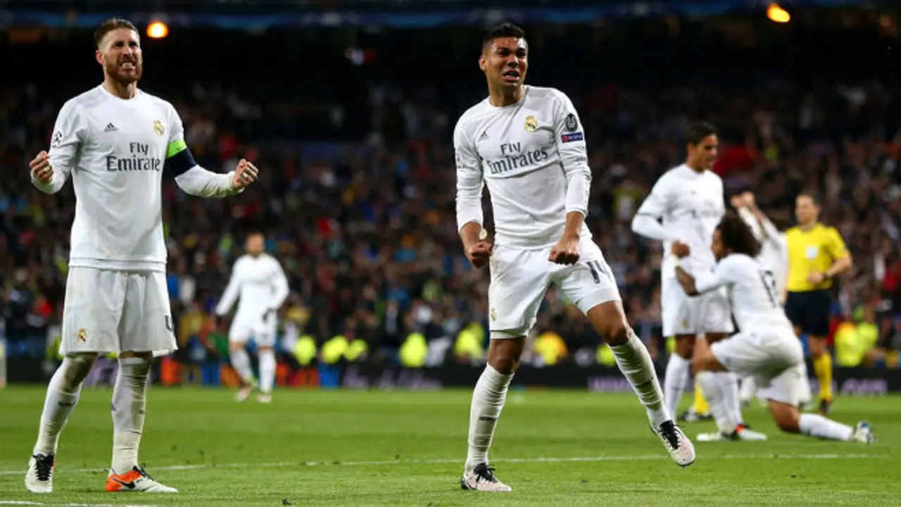 MADRID, SPAIN - APRIL 12:  Sergio Ramos (L) and Casemiro of Real Madrid celebrate victory and reaching the semi finals after the UEFA Champions League quarter final second leg match between Real Madrid CF and VfL Wolfsburg at Estadio Santiago Bernabeu on April 12, 2016 in Madrid, Spain.  (Photo by Alex Grimm/Bongarts/Getty Images)