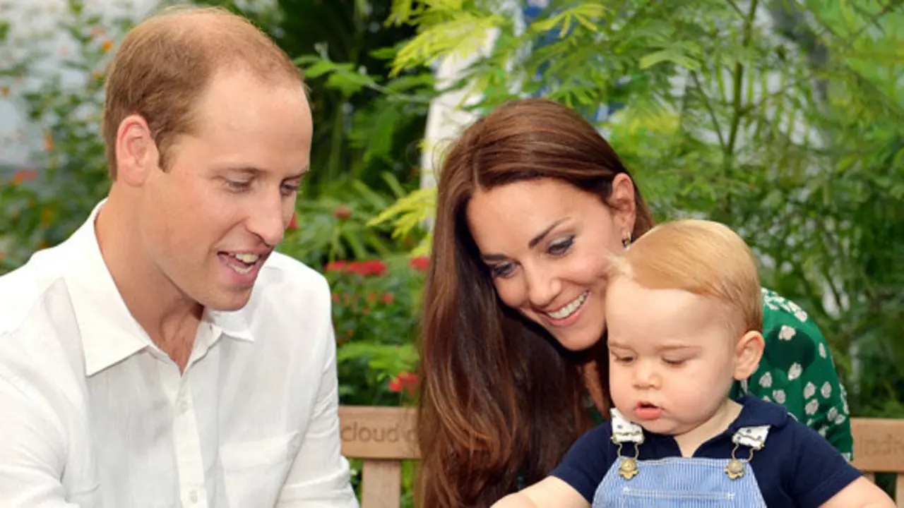 This photo taken Wednesday, July 2, 2014, and released Monday, July 21, 2014, to mark Prince George's first birthday, shows Britain's Prince William and Kate Duchess of Cambridge and the Prince during a visit to the Sensational Butterflies exhibition at the Natural History Museum, London.